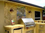 Outdoor turtle mosaic wall mural  behind outdoor kitchen backsplash