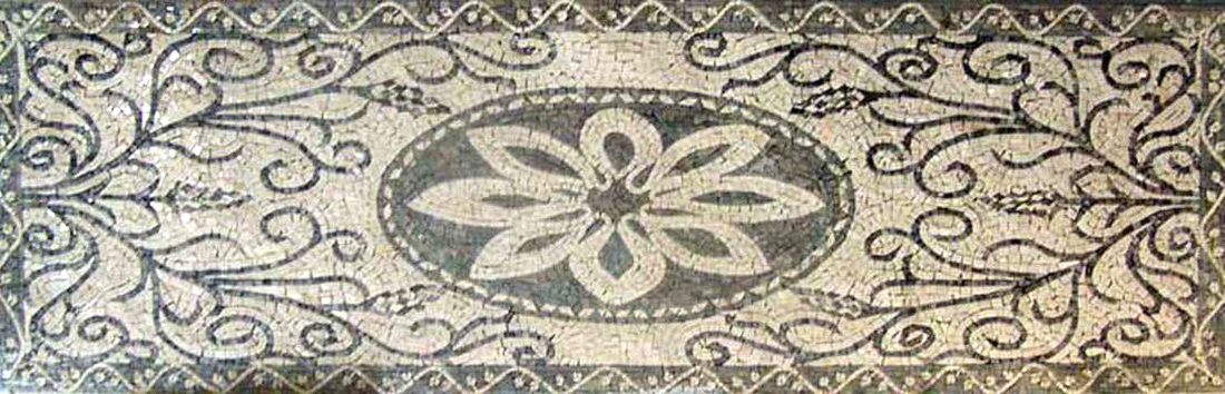 scrollwork mosaic rug with center flower design