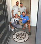 Proud of their floor installation of compass rose mosaic in Kosovo