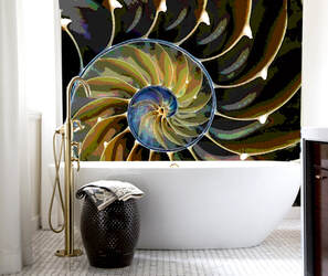 Nautilus seashell mosaic installed behind bathtub